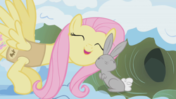 Size: 1280x720 | Tagged: safe, imported from derpibooru, screencap, fluttershy, pegasus, pony, rabbit, winter wrap up, nuzzling, snuggling, winter wrap up song, winter wrap up vest