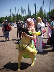 Size: 480x640 | Tagged: safe, artist:emulux, artist:pinku keks, imported from derpibooru, fluttershy, human, airsoft, ar-15, ar15, clothes, cosplay, dokomi, dress, gala dress, grand gala project, gun, irl, irl human, no trigger discipline, photo, rifle, weapon