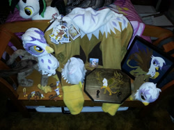 Size: 1143x857 | Tagged: artist needed, safe, imported from derpibooru, gilda, oc, oc:trance sequence, griffon, badge, clothes, collection, hat, hoodie, irl, merchandise, much gilda, patch, photo, plushie, shrine, toy