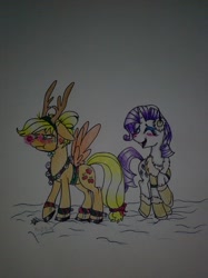 Size: 1280x1707 | Tagged: artist needed, safe, imported from derpibooru, applejack, rarity, pony, reindeer, unicorn, blushing, clothes, costume, earmuffs, female, lesbian, mare, rarijack, shipping, snow, traditional art