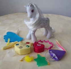 Size: 640x616 | Tagged: safe, imported from derpibooru, star swirl, earth pony, pony, accessories, accessory, amulet, comb, crown, damsel hat, female, g2, hair pick, hennin, irl, magic star swirl, mare, photo, princess hat, purse, ring, wand, wings