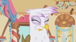 Size: 661x371 | Tagged: safe, imported from derpibooru, screencap, gilda, griffon, griffon the brush off, female, griffon teeth, solo, sugarcube corner, teeth