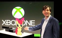 Size: 720x447 | Tagged: safe, imported from derpibooru, apple bloom, human, pony, duo, irl, photo, ponies in real life, standing, xbox one