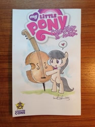Size: 1024x1365 | Tagged: safe, artist:katiecandraw, idw, imported from derpibooru, octavia melody, cello, comic, female, filly, musical instrument, solo, younger
