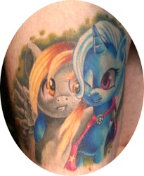 Size: 857x1043 | Tagged: safe, imported from derpibooru, derpy hooves, trixie, human, hug, irl, irl human, photo, smiling, tattoo, wink