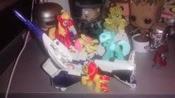 Size: 960x539 | Tagged: safe, imported from derpibooru, big macintosh, fluttershy, lyra heartstrings, sunset shimmer, pony, astrotrain, attack, blind bag, bundle, decepticon, help me, toy, transformers