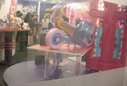 Size: 1021x692 | Tagged: safe, imported from derpibooru, sugarcoat, human, sea pony, equestria girls, friendship games, irl, irl human, london toy fair, merchandise, motorcycle, photo