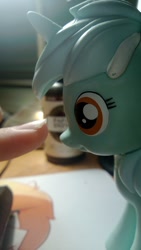 Size: 1073x1907 | Tagged: safe, imported from derpibooru, lyra heartstrings, boop, close-up, finger, imminent boop, nose, photo, vinyl figure