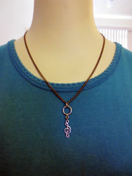 Size: 3300x4400 | Tagged: safe, artist:lyraalluse, imported from derpibooru, octavia melody, craft, cutie mark, irl, jewelry, metal, mirror image, necklace, pendant, photo, treble clef
