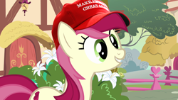 Size: 1000x563 | Tagged: safe, edit, edited screencap, imported from derpibooru, screencap, roseluck, earth pony, pony, cap, donald trump, female, flower, graveyard of comments, grin, hat, make america great again, mare, mouthpiece, politics, smiling, solo, squee