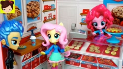 Size: 1280x720 | Tagged: safe, imported from derpibooru, screencap, flash sentry, fluttershy, pinkie pie, equestria girls, animated at source, bakery, clothes, doll, equestria girls minis, eqventures of the minis, food, skirt, toy