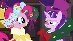 Size: 1280x720 | Tagged: safe, imported from derpibooru, screencap, pinkie pie, snowfall frost, spirit of hearth's warming presents, starlight glimmer, pony, a hearth's warming tail, season 6, clothes, hat, pinkie's present, spectacles, starlight glimmer is not amused, top hat, unamused, wreath