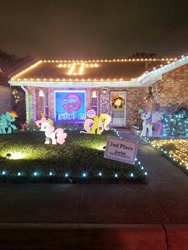 Size: 720x960 | Tagged: safe, imported from derpibooru, fluttershy, pinkie pie, rainbow dash, twilight sparkle, twilight sparkle (alicorn), alicorn, monkey, pony, brick, christmas, christmas lights, christmas wreath, cross, house, irl, my little pony logo, photo, ponies, standee, stock vector, window, yard