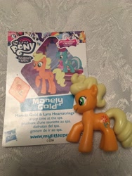 Size: 4032x3024 | Tagged: safe, imported from derpibooru, applejack, cloudchaser, cranky doodle donkey, discord, flam, gilda, hoity toity, lyra heartstrings, manely gold, pinkie pie, princess celestia, rainbow dash, rarity, griffon, absurd resolution, australia, blind bag, blind bag card, marigold, toy