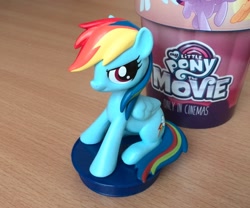 Size: 1120x932 | Tagged: safe, imported from derpibooru, rainbow dash, pegasus, pony, my little pony: the movie, female, irl, looking at you, mare, photo, sitting, toy