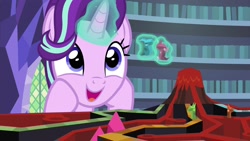Size: 1920x1080 | Tagged: safe, imported from derpibooru, screencap, starlight glimmer, pony, unicorn, uncommon bond, board game, cute, dragon pit, female, glimmerbetes, glowing horn, happy, magic, mare, solo, telekinesis