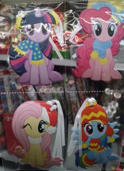 Size: 513x706 | Tagged: safe, imported from derpibooru, fluttershy, pinkie pie, rainbow dash, twilight sparkle, alicorn, christmas, clothes, cute, dashabetes, gift tag, hat, holiday, irl, merchandise, one eye closed, photo, santa hat, scarf, shyabetes, stocking cap, twilight sparkle (alicorn), wink