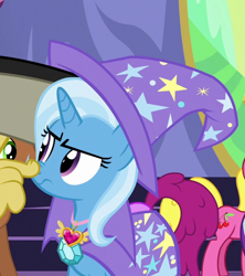 Size: 628x706 | Tagged: safe, imported from derpibooru, screencap, berry punch, berryshine, cherry berry, discord, meadow song, trixie, pony, celestial advice, cape, clothes, hat, solo focus, trixie is not amused, trixie's cape, trixie's hat, unamused