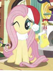 Size: 365x486 | Tagged: safe, imported from derpibooru, fluttershy, pony, christmas, cute, female, fluttershy's cottage, hat, holiday, looking at you, magazine, magazine scan, mare, official, one eye closed, santa hat, scan, shyabetes, smiling, solo