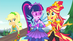 Size: 1100x618 | Tagged: safe, imported from derpibooru, screencap, applejack, sci-twi, sunset shimmer, twilight sparkle, equestria girls, legend of everfree, clothes, crystal guardian, crystal wings, gloves, open mouth, pants, ponied up, scenery, super strength