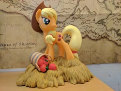 Size: 4048x3036 | Tagged: safe, imported from derpibooru, photographer:captaincakewalk, applejack, pony, absurd resolution, apple, basket, coin bank, diamond select toys, food, irl, merchandise, photo, skyrim, solo, the elder scrolls