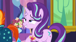 Size: 684x378 | Tagged: safe, imported from derpibooru, screencap, starlight glimmer, sunburst, pony, unicorn, celestial advice, balloon, equestrian pink heart of courage, flower, lidded eyes, offscreen character, raised hoof, smiling, solo focus, twilight's castle