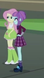 Size: 210x368 | Tagged: safe, imported from derpibooru, screencap, fluttershy, sunny flare, equestria girls, friendship games, boots, clothes, crystal prep academy uniform, female, hand on elbow, hand on hip, high heel boots, raised leg, school uniform, shoes, skirt, socks