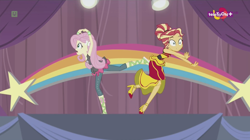 Size: 1136x638 | Tagged: safe, imported from derpibooru, screencap, fluttershy, sunset shimmer, dance magic, equestria girls, spoiler:eqg specials, accident, alternate hairstyle, awkward moment, canterlot high, clothes, dancing, dress, duo, female, flamenco dress, high heels, rainbow, shoes, skirt, stars, sunset shimmer flamenco dress, teletoon, tutu