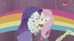 Size: 1136x638 | Tagged: safe, imported from derpibooru, screencap, fluttershy, rarity, dance magic, equestria girls, spoiler:eqg specials, ballet slippers, canterlot high, clothes, duo, eyes closed, female, one eye open, open mouth, rainbow, skirt, teletoon