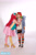 Size: 1365x2048 | Tagged: safe, artist:shadeila, imported from derpibooru, pinkie pie, rainbow dash, human, cheek kiss, clothes, cosplay, costume, desucon, female, high heels, irl, irl human, kissing, lesbian, photo, pinkiedash, rainbow socks, shipping, shoes, socks, striped socks