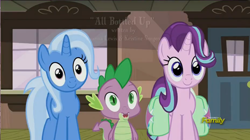 Size: 1392x780 | Tagged: safe, imported from derpibooru, screencap, spike, starlight glimmer, trixie, dragon, pony, unicorn, all bottled up, animation error, baby, baby dragon, cute, diatrixes, discovery family, discovery family logo, female, glimmerbetes, hair flip, logo, male, mare, missing eyelashes, saddle bag, smiling, spikabetes, the amazing trio of friendship, thousand yard stare, train station, watermark