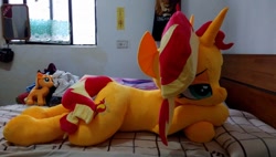 Size: 960x546 | Tagged: safe, artist:ec31314, artist:nekokevin, imported from derpibooru, sunset shimmer, pony, unicorn, irl, lidded eyes, life size, photo, plushie, prone