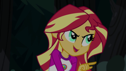 Size: 1280x720 | Tagged: safe, imported from derpibooru, screencap, sunset shimmer, equestria girls, legend of everfree, camp everfree outfits, clothes, female, night, open mouth, pointing, smiling, smirk, solo, talking