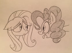 Size: 2809x2066 | Tagged: safe, artist:sparkarez, imported from derpibooru, fluttershy, pinkie pie, earth pony, pegasus, pony, bust, duo, eye contact, floppy ears, frown, kinetic contrast, looking at each other, monochrome, portrait, sad, smiling, tongue out, traditional art, unamused