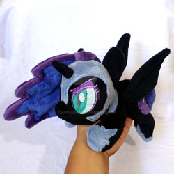 Size: 1024x1024 | Tagged: safe, artist:appledew, imported from derpibooru, nightmare moon, alicorn, pony, beanie (plushie), female, hand, irl, jewelry, mare, photo, plushie, prone, regalia, solo, spread wings, watermark, wings