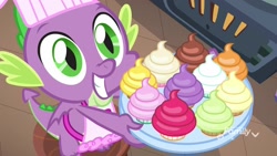 Size: 1920x1080 | Tagged: safe, imported from derpibooru, screencap, spike, dragon, father knows beast, apron, baby, baby dragon, baking, chef's hat, clothes, cupcake, cute, discovery family, discovery family logo, folded wings, food, green eyes, grin, gullible, hat, kitchen, logo, male, naked apron, oven, platter, smiling, solo, spikabetes, teeth, twilight's castle, watermark, winged spike, wings