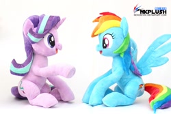 Size: 1200x800 | Tagged: safe, artist:nekokevin, imported from derpibooru, rainbow dash, starlight glimmer, pegasus, pony, unicorn, series:nekokevin's glimmy, cute, dashabetes, duo, female, glimmerbetes, irl, looking at each other, mare, open mouth, photo, plushie, raised hoof, simple background, sitting, smiling, spread wings, underhoof, watermark, white background, wings