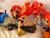 Size: 1800x1350 | Tagged: safe, artist:whatthehell!?, imported from derpibooru, flash sentry, sunset shimmer, equestria girls, bed, bedroom, bikini, black sports bra, clothes, doll, equestria girls minis, fall formal outfits, irl, knife, maid, merchandise, photo, ponied up, sacrifice, sandals, sports bra, suit, summer sunset, sunset sushi, swimsuit, toy, tuxedo