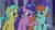 Size: 1920x1080 | Tagged: safe, imported from derpibooru, screencap, berry blend, berry bliss, citrine spark, fire quacker, peppermint goldylinks, earth pony, pegasus, pony, unicorn, school raze, background pony, bow, bracelet, braid, cute, female, folded wings, friendship bracelet, friendship student, hair bow, jewelry, mare, peppermint adoralinks, raised hoof, trio, wings