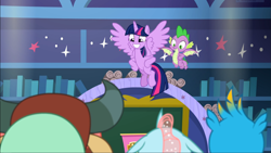 Size: 1669x939 | Tagged: safe, imported from derpibooru, screencap, gallus, ocellus, spike, twilight sparkle, yona, alicorn, dragon, pony, a matter of principals, classroom, duo focus, female, flying, happy, hooves on hips, male, school of friendship, smiling, twilight sparkle (alicorn), winged spike, wings