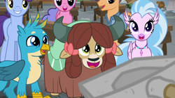 Size: 1280x720 | Tagged: safe, imported from derpibooru, screencap, gallus, rockhoof, silverstream, yona, griffon, pony, yak, a rockhoof and a hard place, background pony, cute, diastreamies, excited, gallabetes, male, rockhoof's shovel, shovel, yonadorable