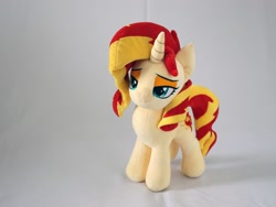 Size: 3000x2250 | Tagged: safe, artist:nekokevin, imported from derpibooru, sunset shimmer, pony, unicorn, female, irl, lidded eyes, mare, photo, plushie, simple background, smiling, solo, white background