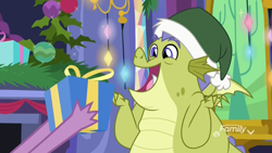 Size: 1920x1080 | Tagged: safe, imported from derpibooru, screencap, sludge (dragon), spike, dragon, father knows beast, christmas, christmas decoration, christmas ornament, decoration, discovery family logo, excited, hat, hearth's warming, holiday, male, open mouth, present, santa hat, sludge (g4), twilight's castle