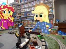 Size: 1800x1350 | Tagged: safe, imported from derpibooru, applejack, sunset shimmer, equestria girls, clothes, equestria girls in real life, irl, model railroads, pajamas, photo, thomas the tank engine, thomaszoey3000