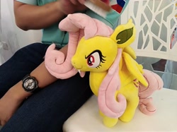 Size: 4032x3016 | Tagged: safe, imported from derpibooru, photographer:horsesplease, fluttershy, bat pony, human, bat ponified, brushie, comb, female, flutterbat, irl, malaysia, photo, plushie, race swap, smiling, smirk, the friendship express