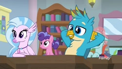 Size: 1920x1080 | Tagged: safe, imported from derpibooru, screencap, berry blend, berry bliss, gallus, ocellus, silverstream, griffon, hippogriff, pony, a rockhoof and a hard place, arm behind back, background pony, beak, female, friendship student, male, school of friendship, smiling