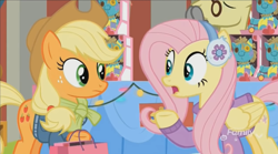 Size: 1350x752 | Tagged: safe, imported from derpibooru, screencap, applejack, flim, fluttershy, holly the hearths warmer doll, best gift ever, clothes, discovery family logo, earmuffs, glasses, shopping bag, shopping bags, sweater, table