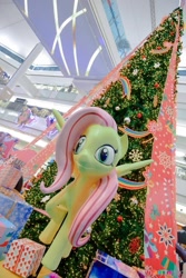 Size: 683x1024 | Tagged: safe, imported from derpibooru, fluttershy, christmas, christmas tree, creepy, holiday, irl, nightmare fuel, photo, statue, thailand, tree