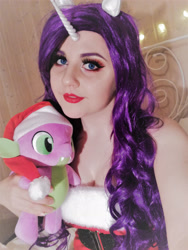 Size: 2448x3264 | Tagged: safe, artist:shadeila, imported from derpibooru, rarity, spike, human, christmas, clothes, cosplay, costume, hat, holiday, horn, irl, irl human, photo, plushie, santa hat, sleeveless