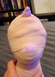 Size: 920x1280 | Tagged: safe, artist:supra80, imported from derpibooru, part of a set, twilight sparkle, pony, unicorn, bandage, blindfold, bondage, hand, irl, medical bondage, mummification, mummified, part of a series, photo, plushie, solo